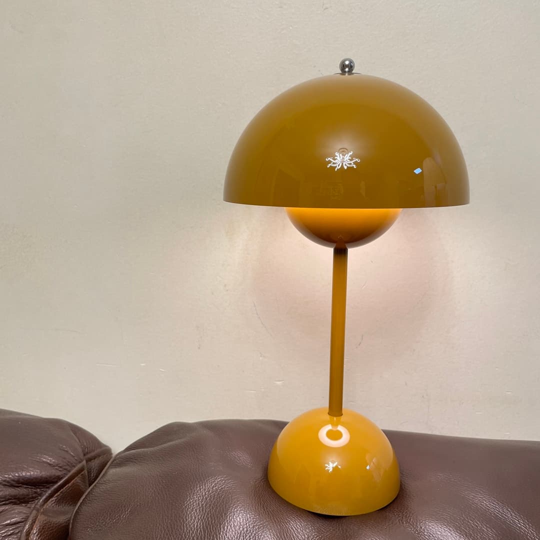 A custom mustard-yellow mushroom table lamp — an unusual home-goods piece from a specialty production run
