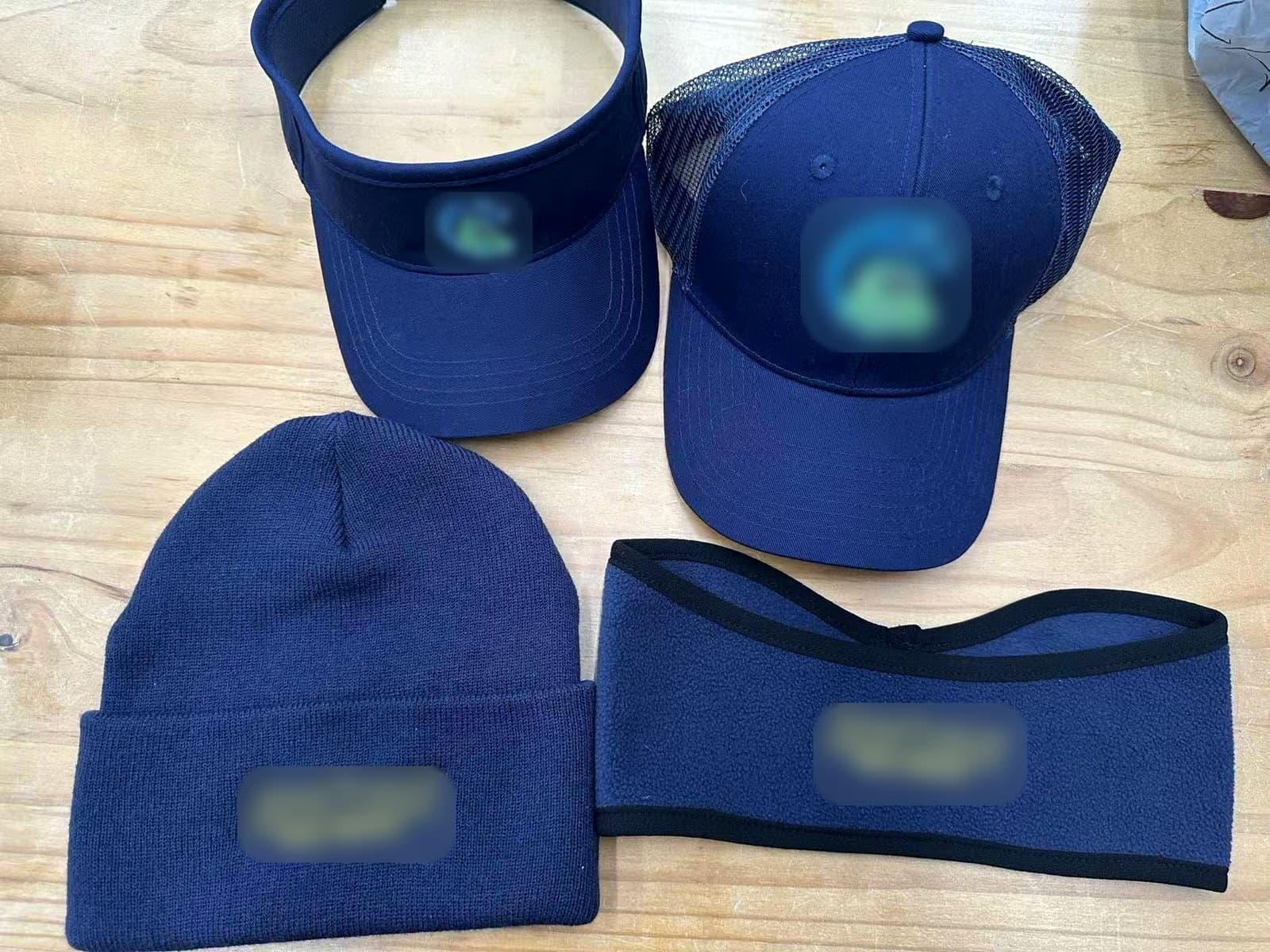 The new headwear system: visor, trucker cap, beanie, and fleece headband on one base color